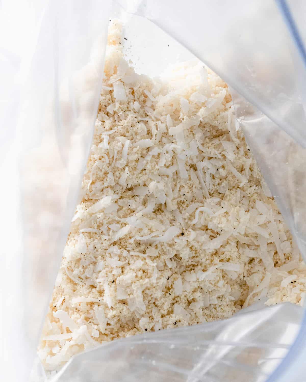 A bag of shredded coconut, almond flour, and seasonings.