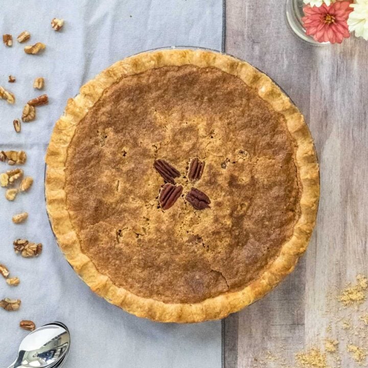 Derby Pie with nuts sprinkled on side.