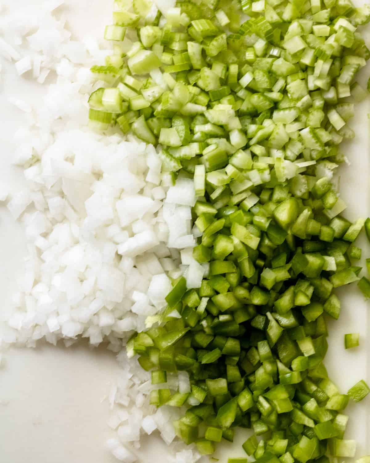 The Holy trinity: chopped onion, celery, and green bell pepper.