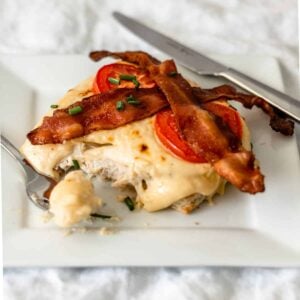 Plate of hot brown sandwich with a bite on a fork.