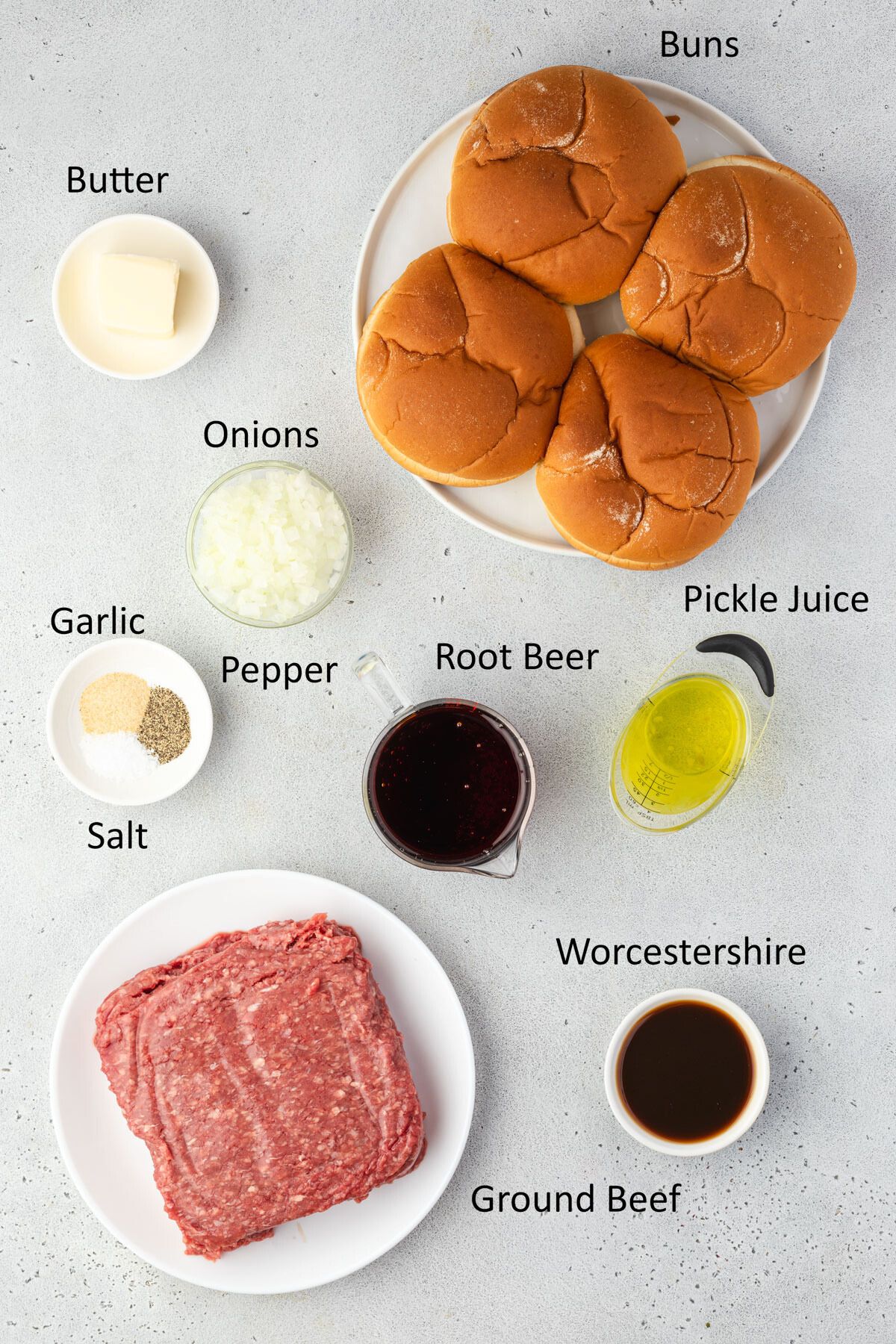 Overhead of the loose meat sandwich ingredients in individual dishes.