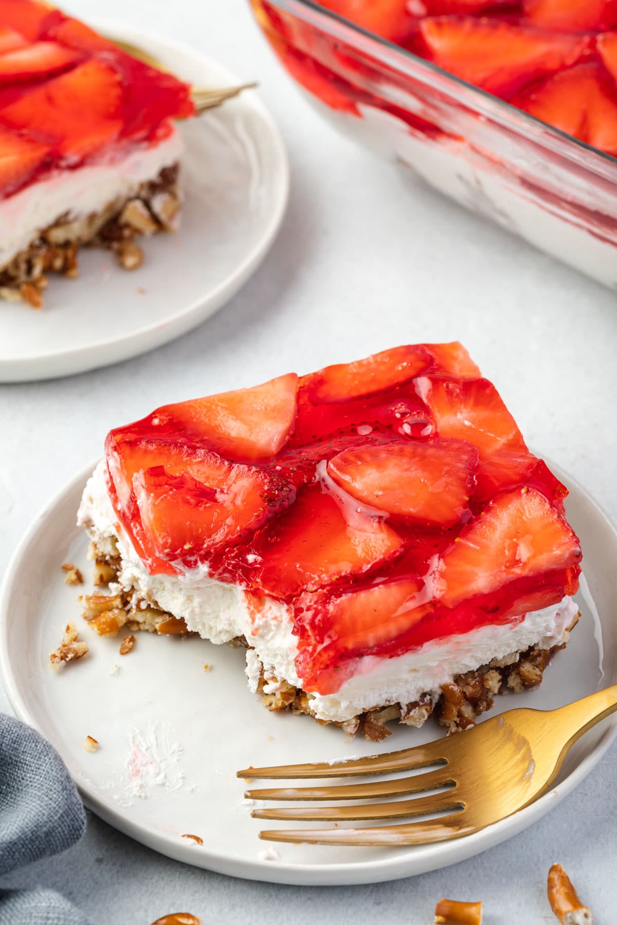 Strawberry Pretzel Salad with a bite out of it.
