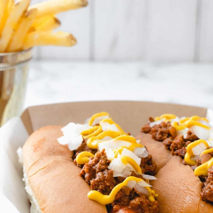 Two coney dogs, a famous food from Michigan, along with French fries.