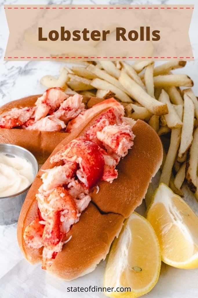 Pinterest pin of two lobster rolls with French fries, mayo, and lemons.