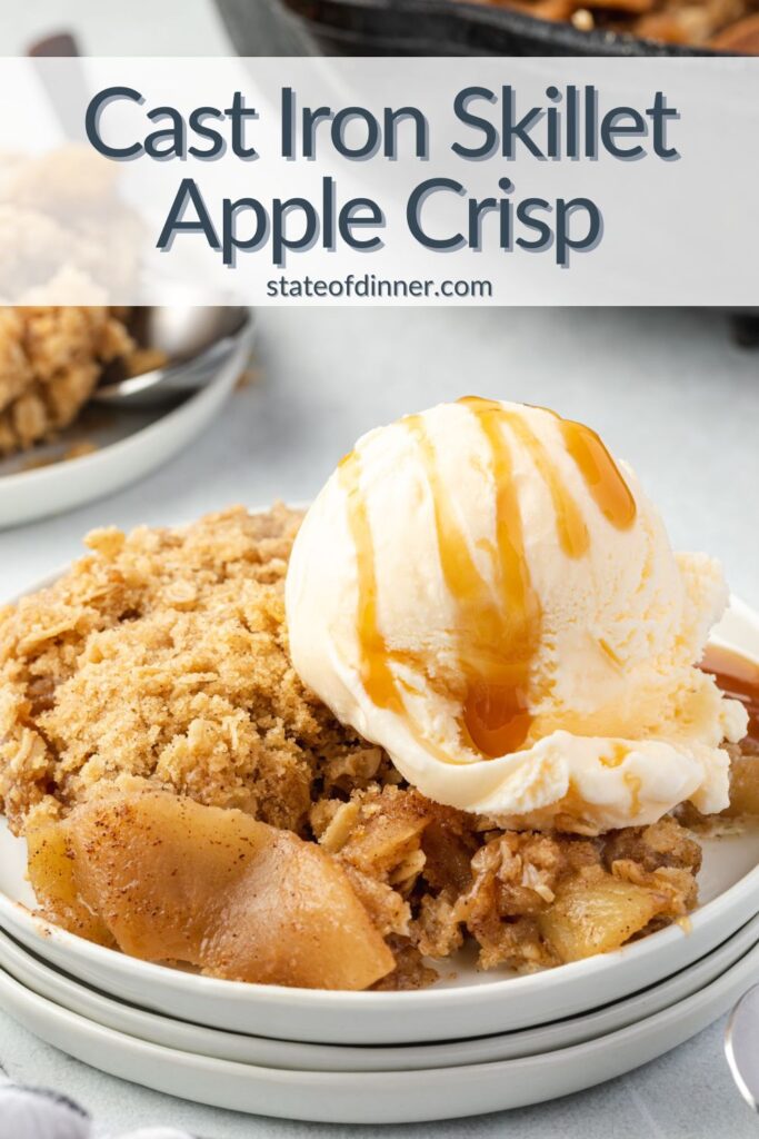 Pinterest pin: Cast iron skillet apple crisp on a plate topped with ice cream and caramel sauce.
