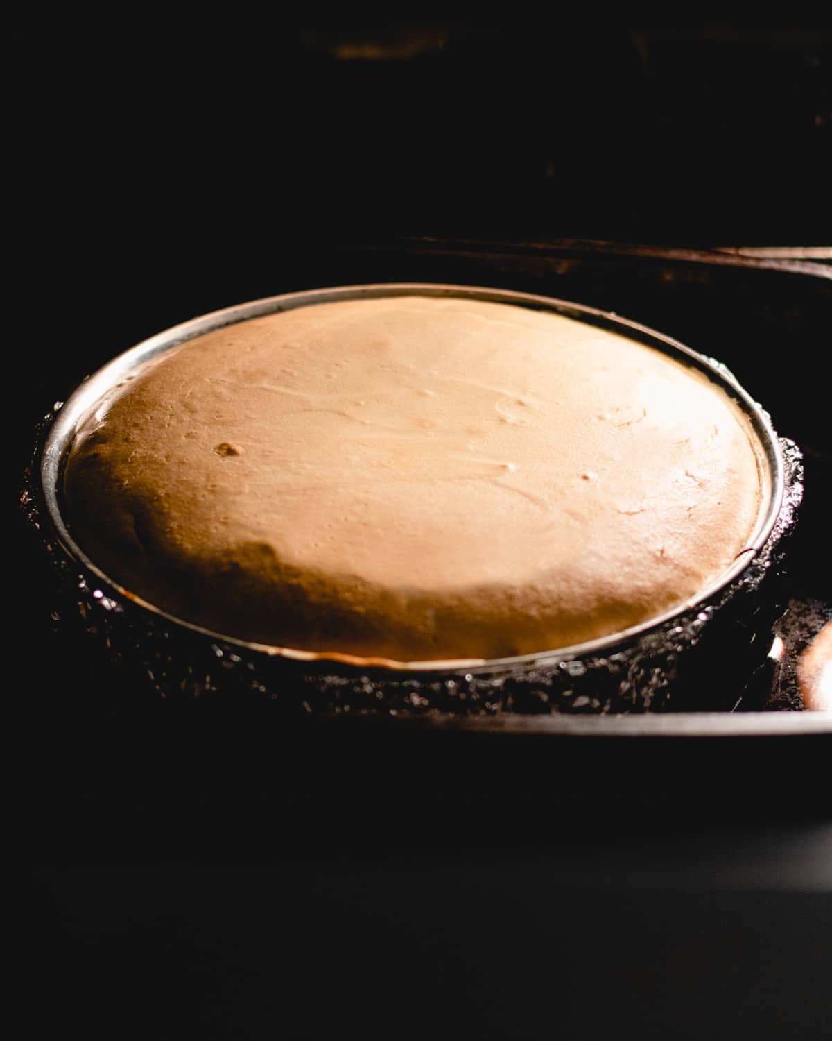 Cheesecake is baking in the oven.