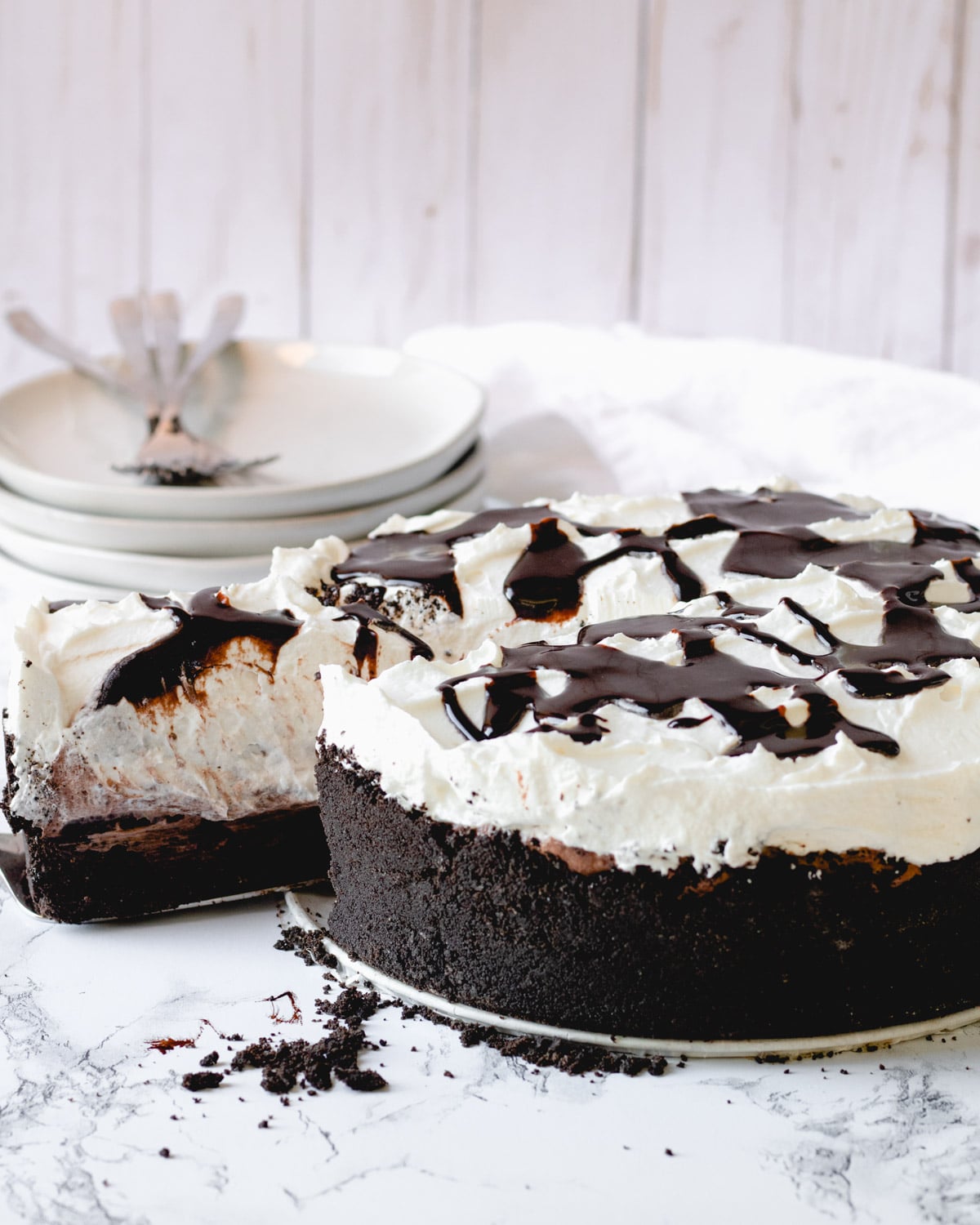 Slice of Mississippi mud pie being remobed from whole pie.