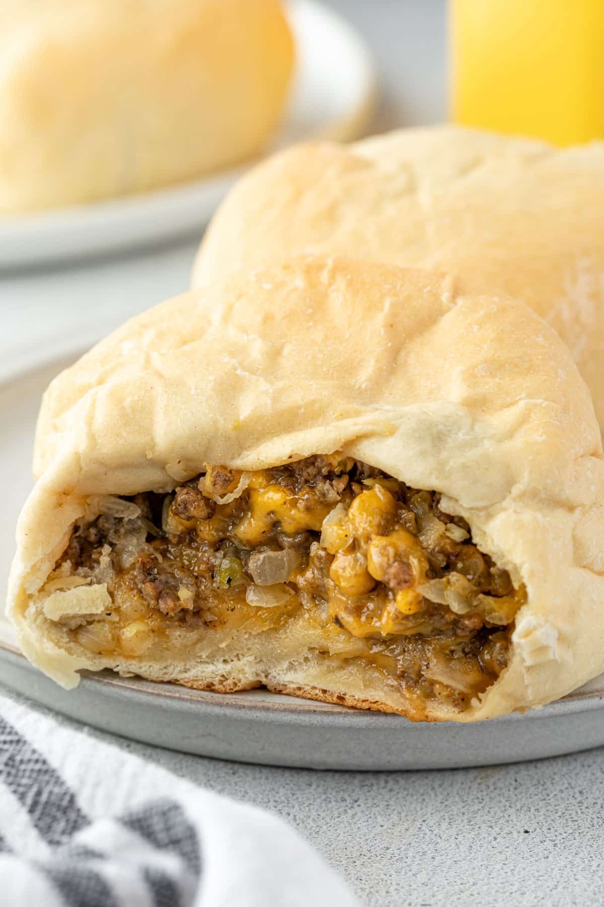 A bread sandwich pocked stuffed with ground beef and melty cheese.