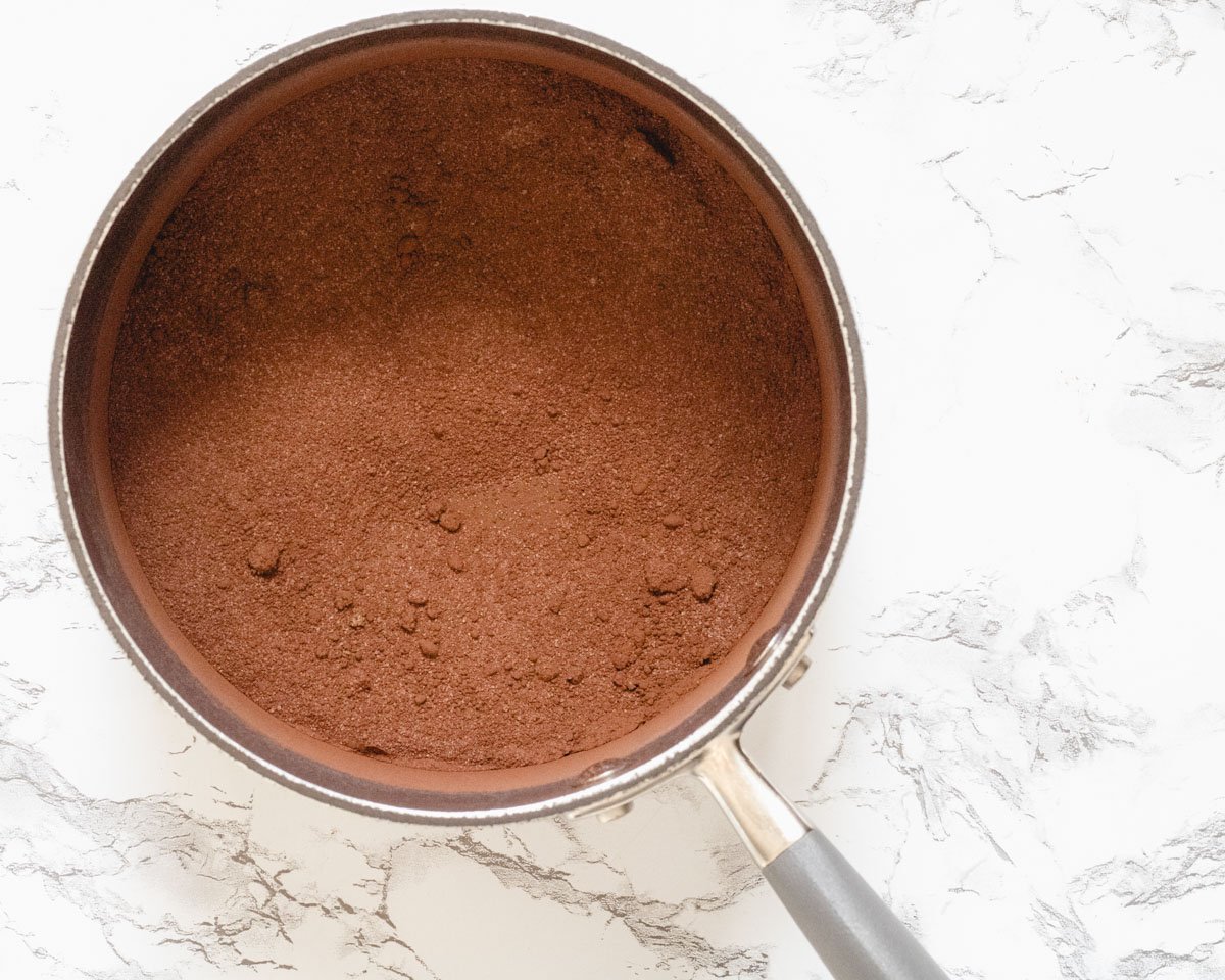 Dutch cocoa and sugar, sifted together in a pan.