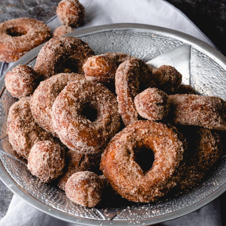 A bowl of apple cider donuts and donut holes.