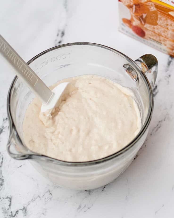 Mixing batter for funnel cakes.