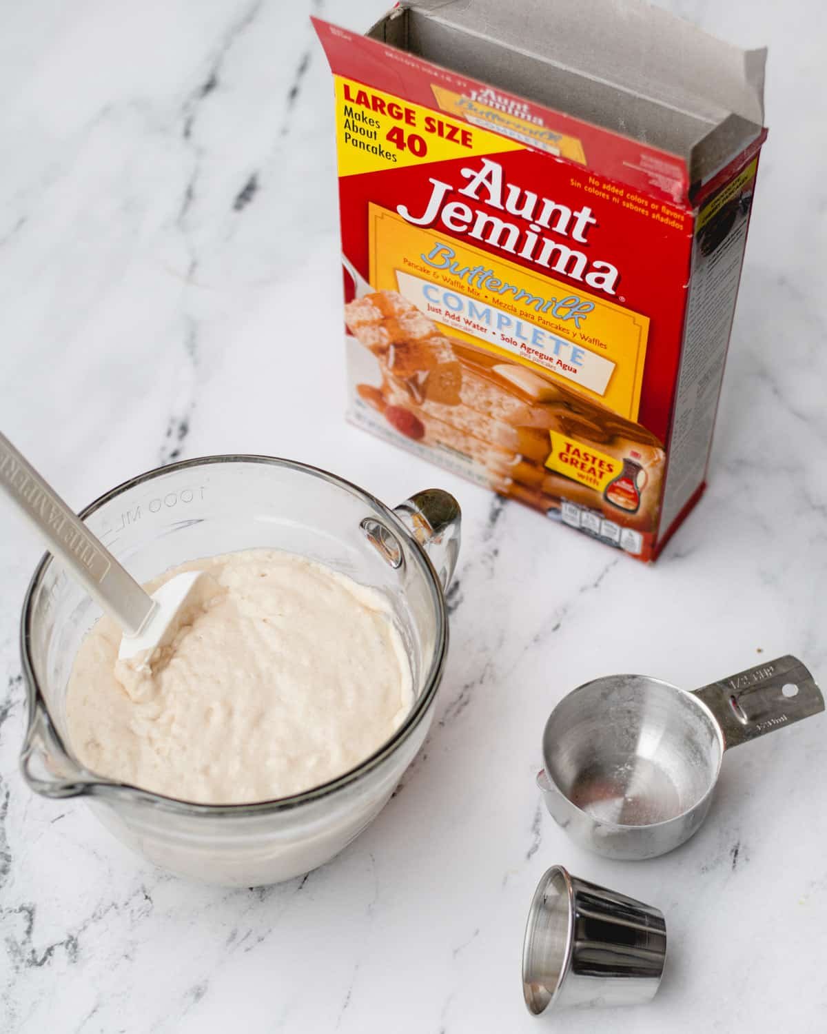 Mixing batter for funnel cakes.