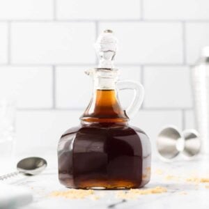 A glass bottle of brown sugar simple syrup.