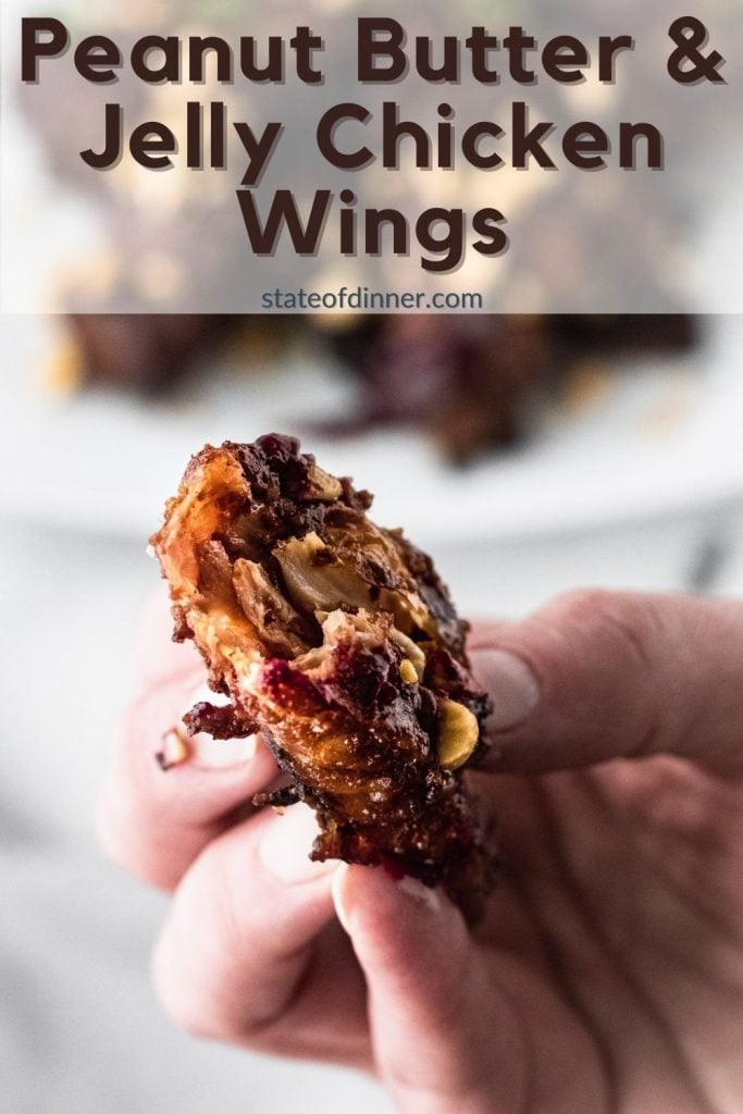 Pinterest pin: close up of peanut butter & jelly chicken wings with a bite out of it.