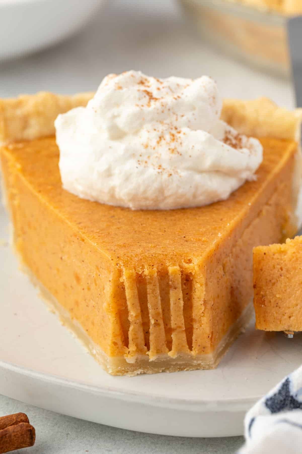 Overhead view of sweet potato pie with two pieces sliced.