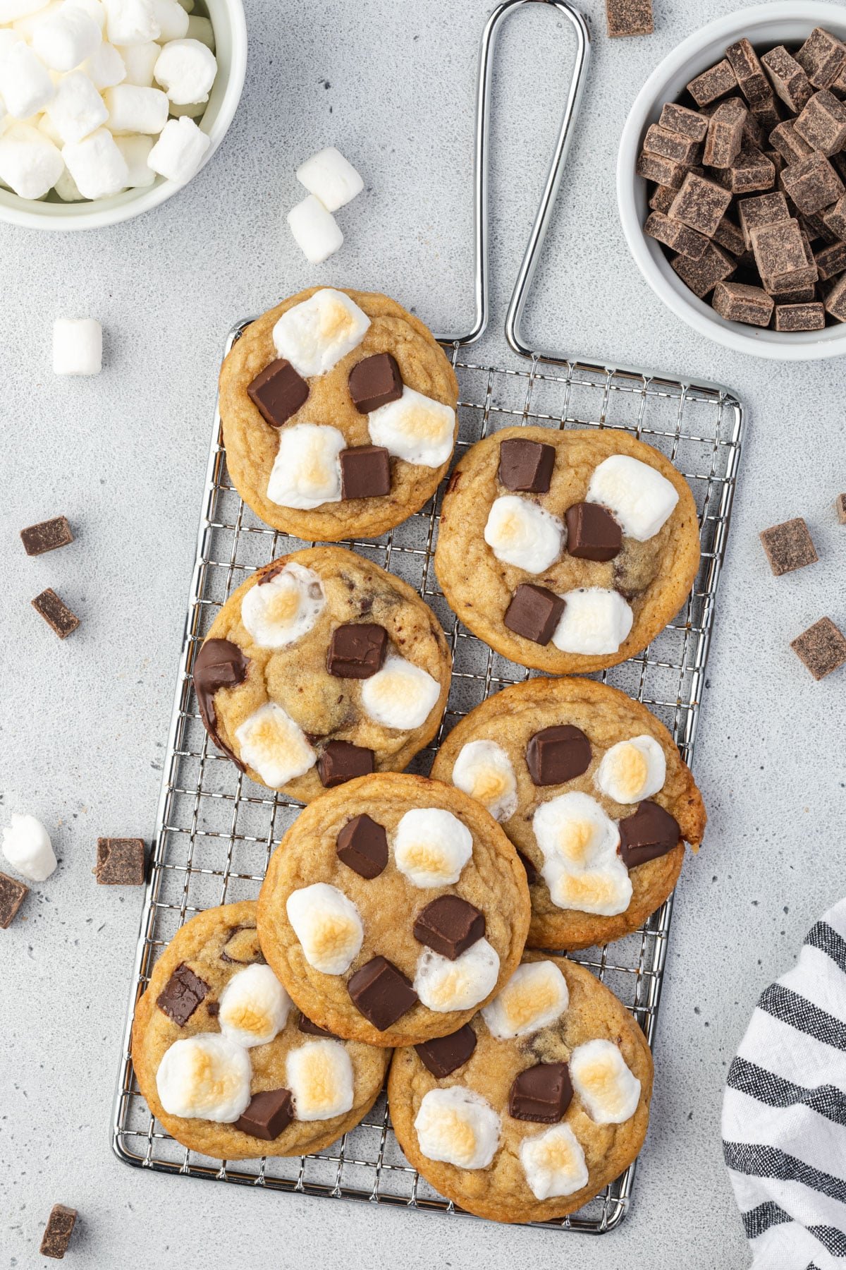 Marshmallow chocolate chunk cookies on an old fashioned wire rack.