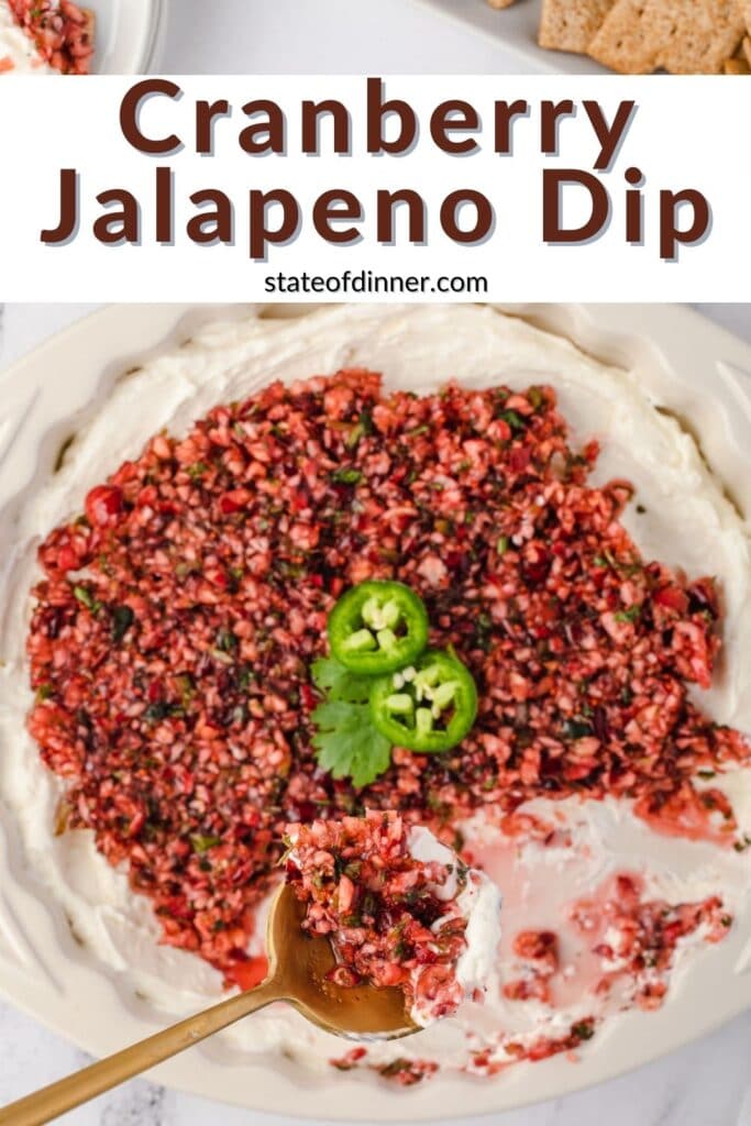 Pinterest Pin of cranberry jalapeno dip with scoop out of it.