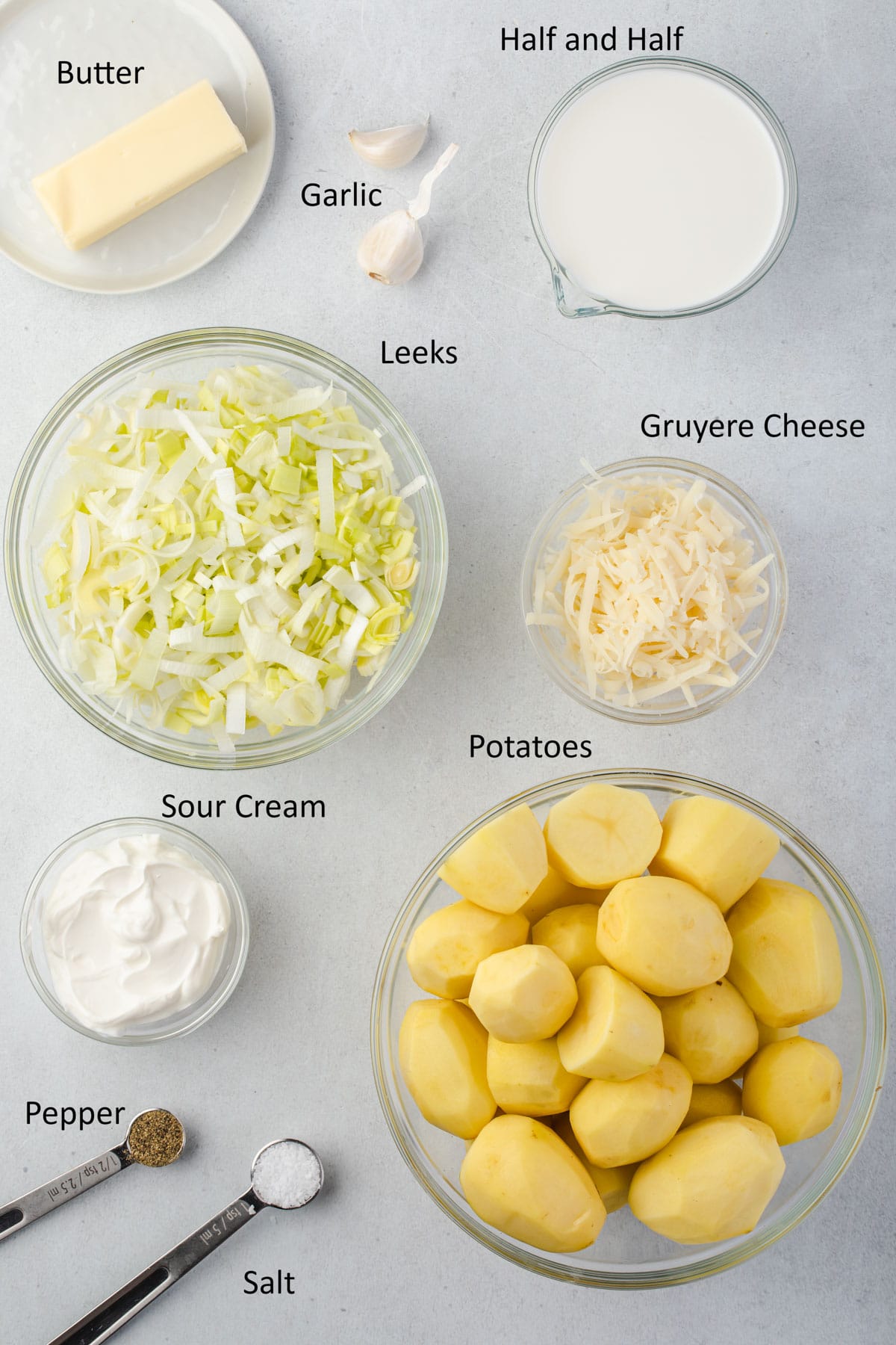 Overhead labeled ingredients for gruyere and leek mashed potatoes.