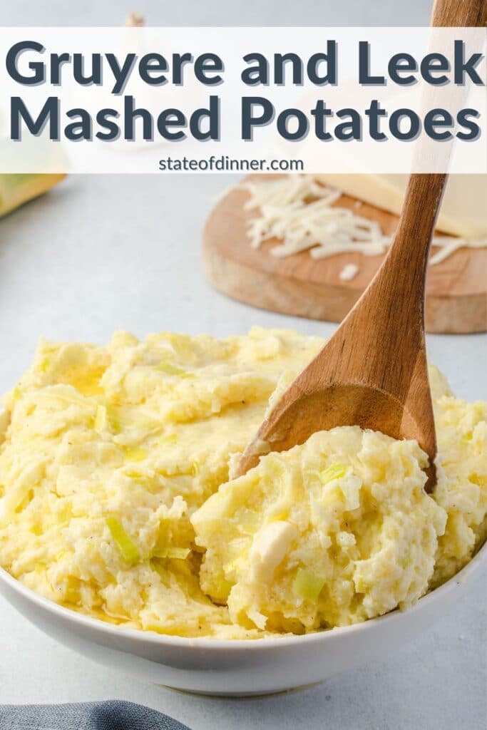 Pinterest Pin: Wooden spoon scooping out gruyere and leek mashed potatoes.