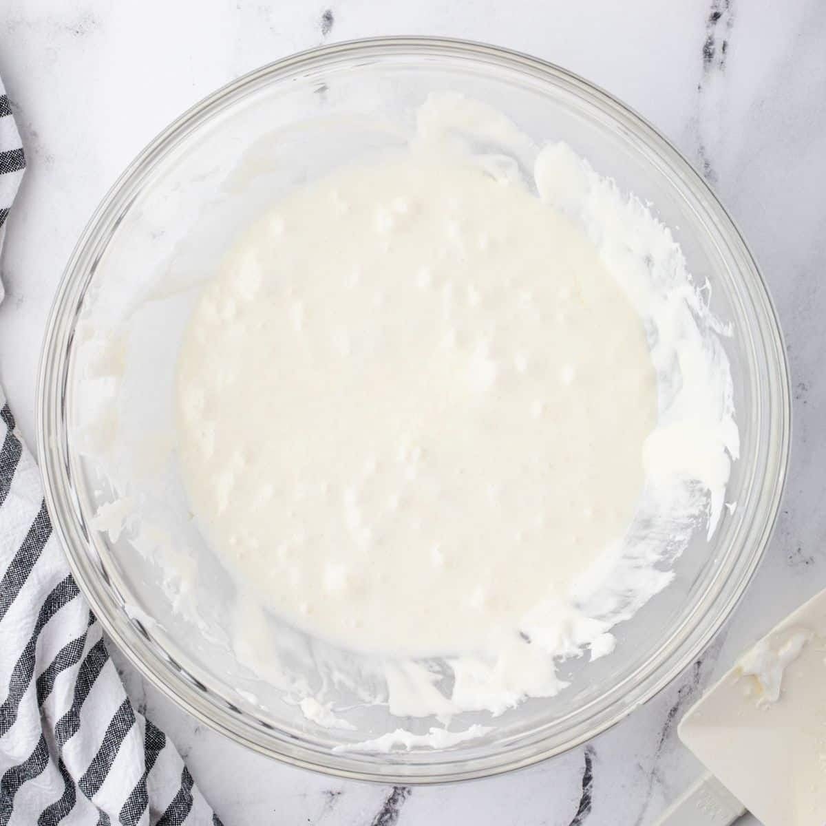 A glass bowl of melted marshmallows.