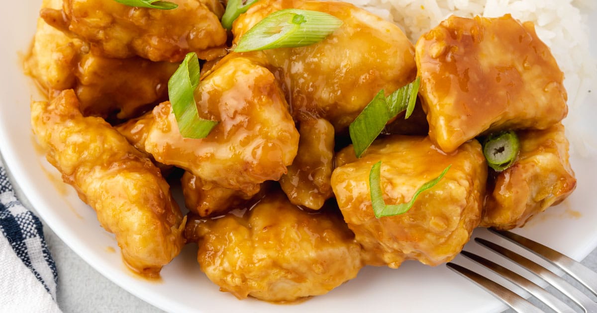 Close up of orange chicken pieces.