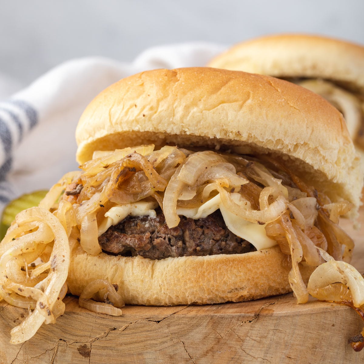 https://stateofdinner.com/wp-content/uploads/2022/06/fried-onion-burger-featured-2.jpg