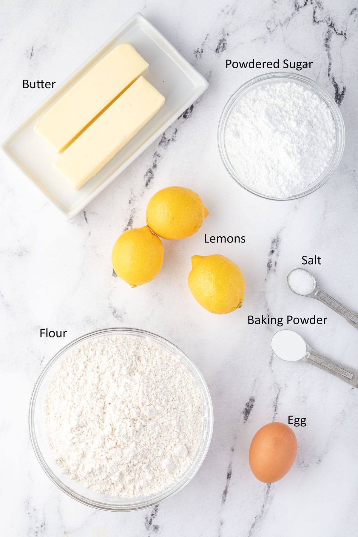 Cookie ingredients: butter, powdered sugar, fresh lemons, flour, salt, baking powder, egg.
