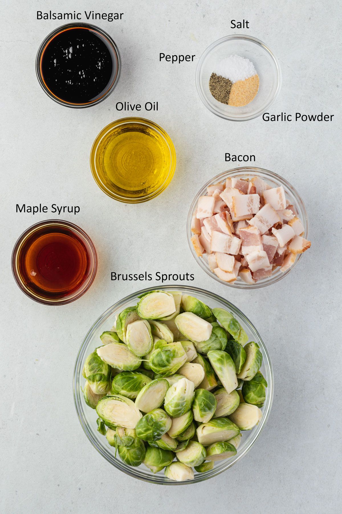 Overhead of labeled maple balsamic brussels sprouts ingredients.