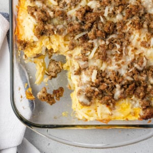 Close up of 5 ingredient hashbrown casserole with a serving cut out of it.