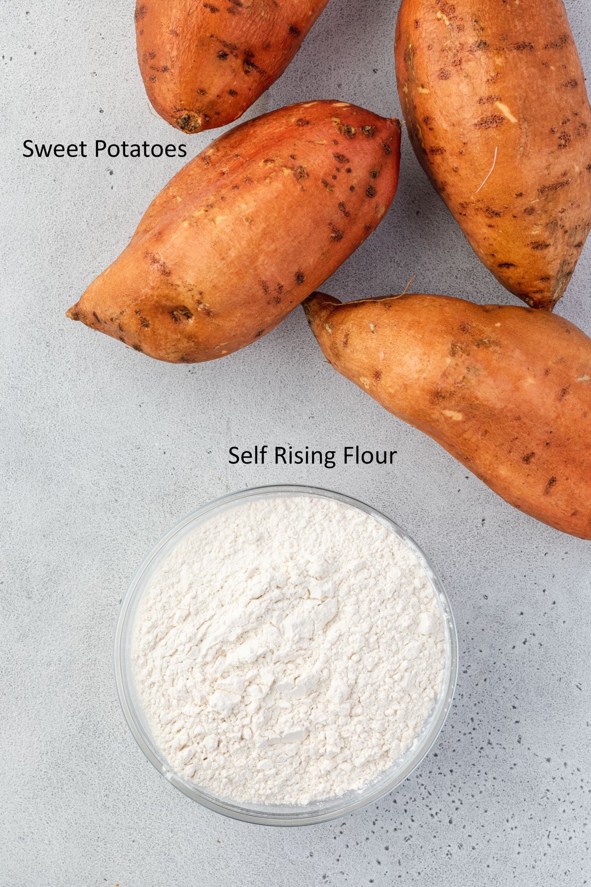 4 sweet potatoes and a bowl of self-rising flour.