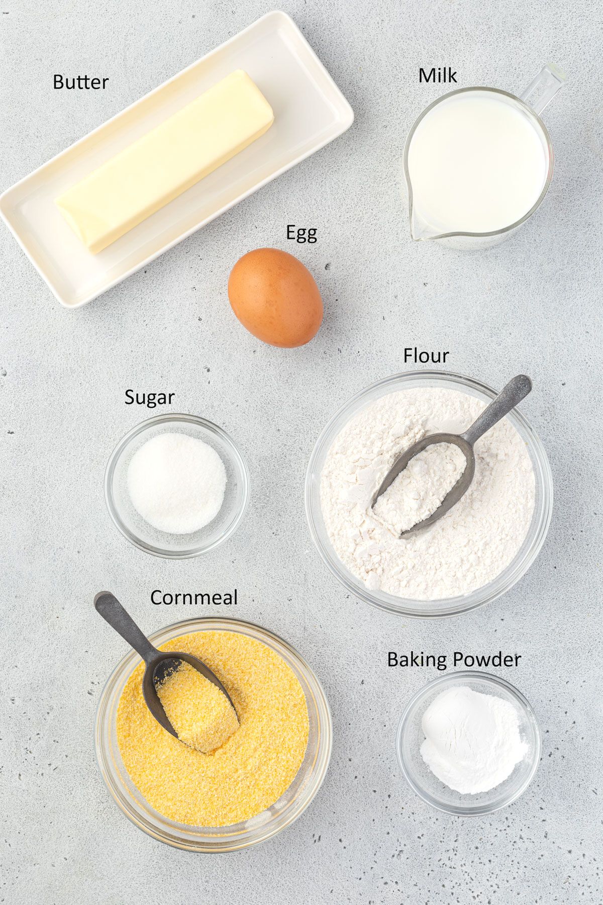Overhead of labeled ingredients for cornbread without buttermilk.