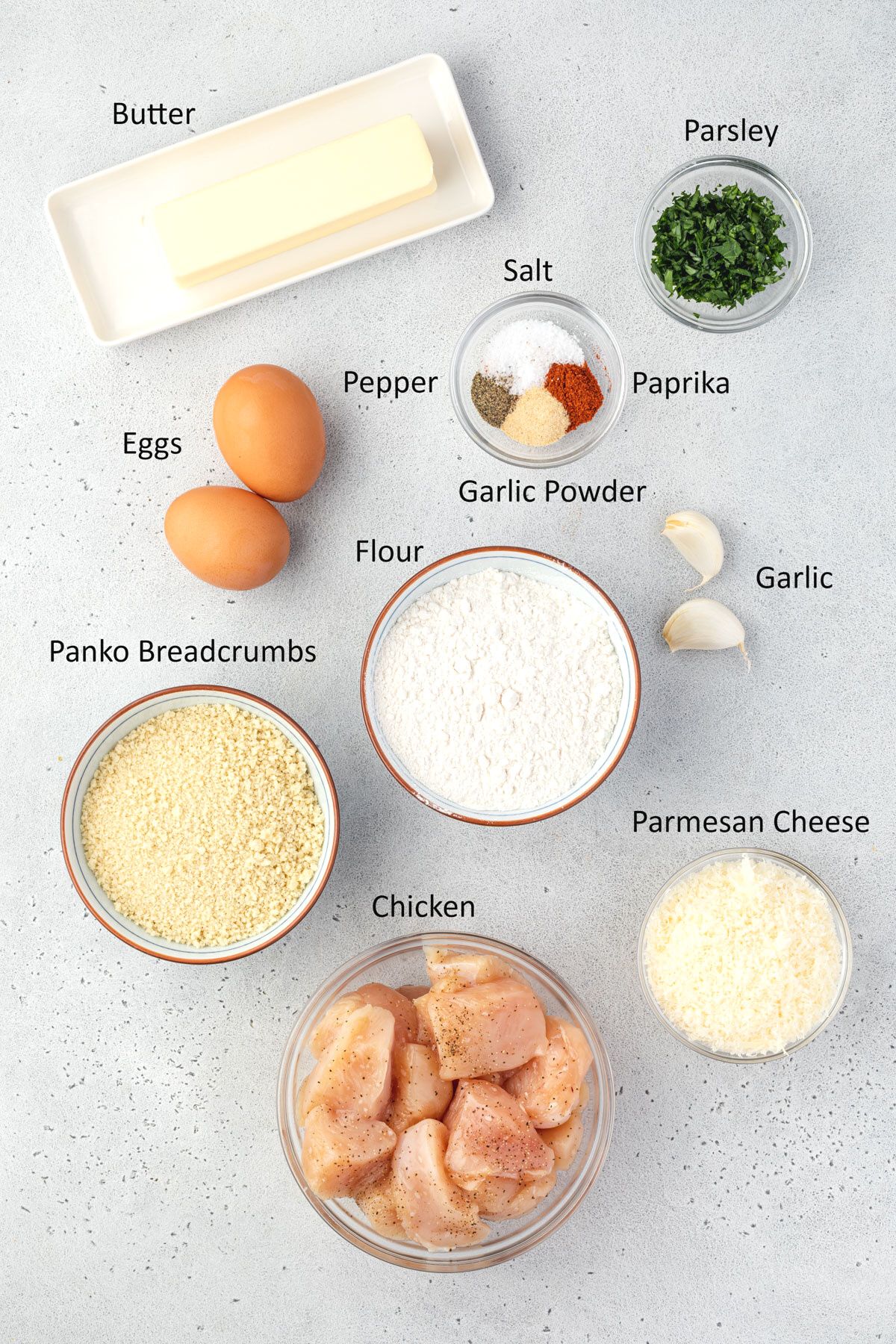 Overhead of labeled ingredients for boneless garlic parmesan wings.