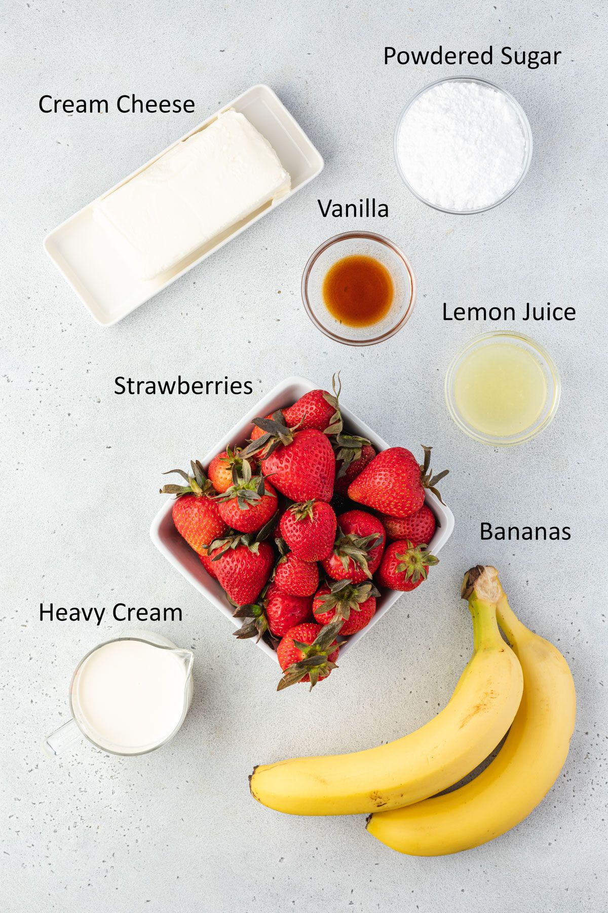 Ingredients for strawberry banana dessert.