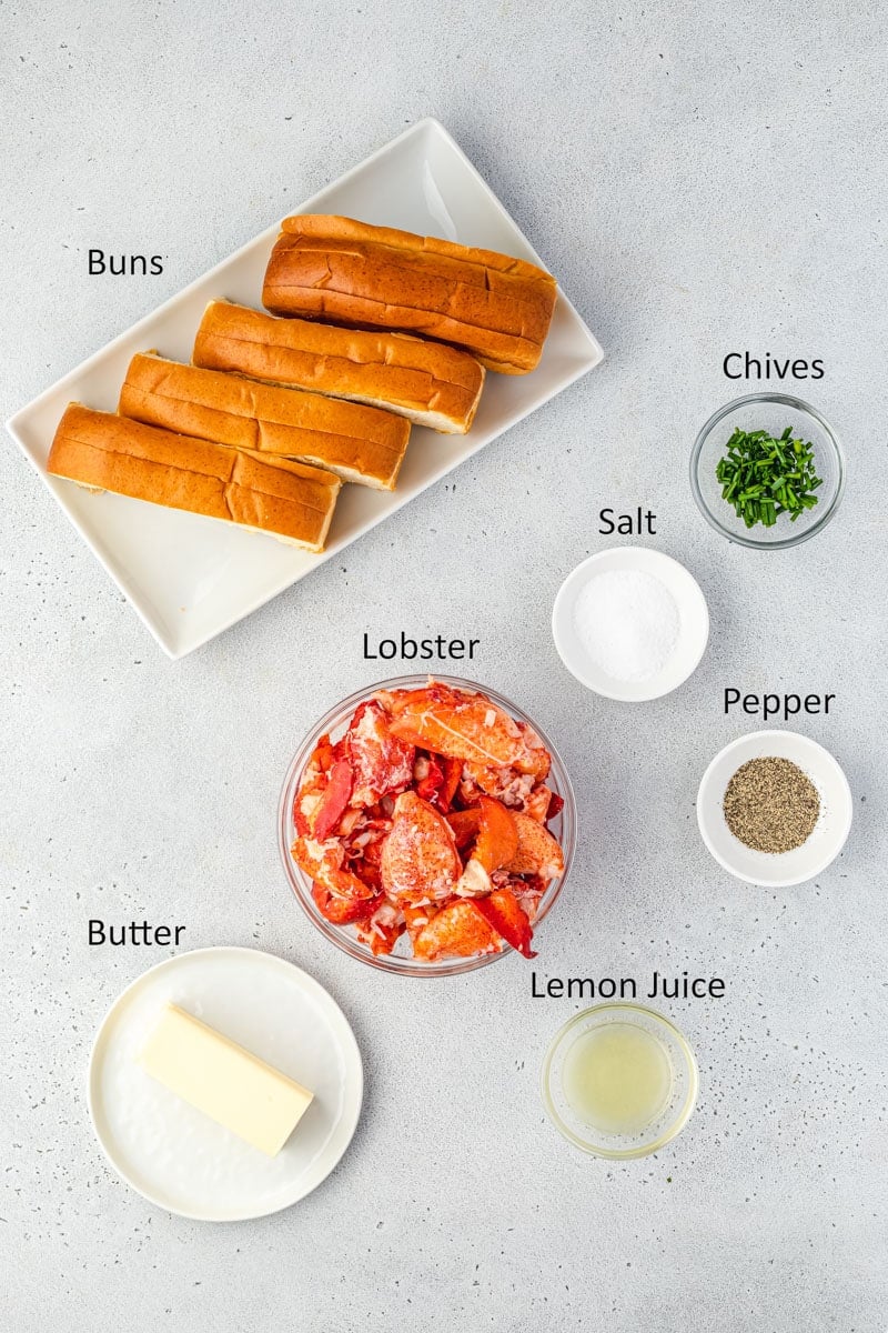 Overhead of the ingredients for warm lobster rolls in individual bowls.