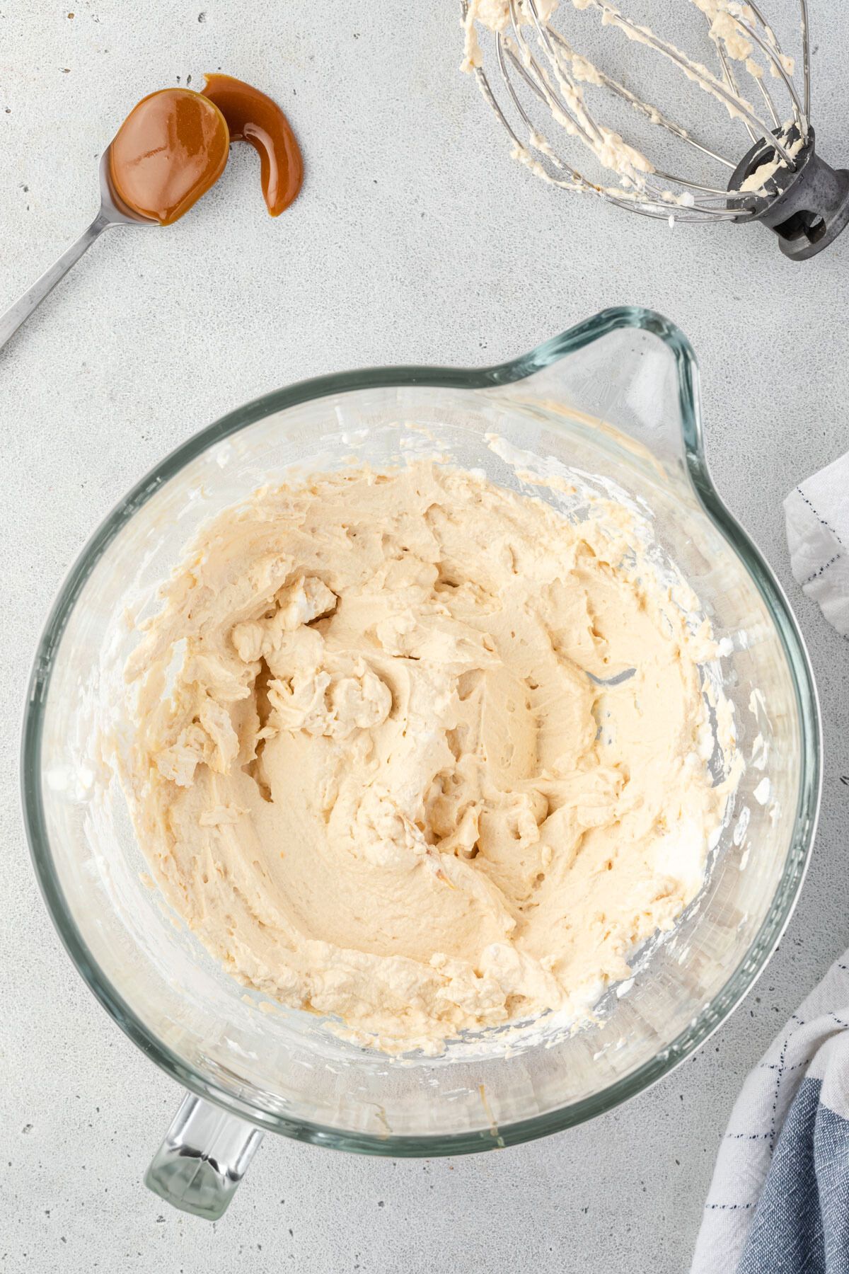 Large mixing bowl with prepared caramel whipped cream.