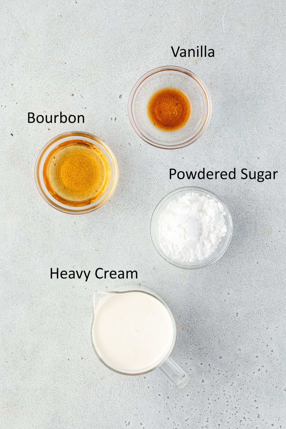 Bourbon, vanilla, powdered sugar, and whipped cream in individual containers.