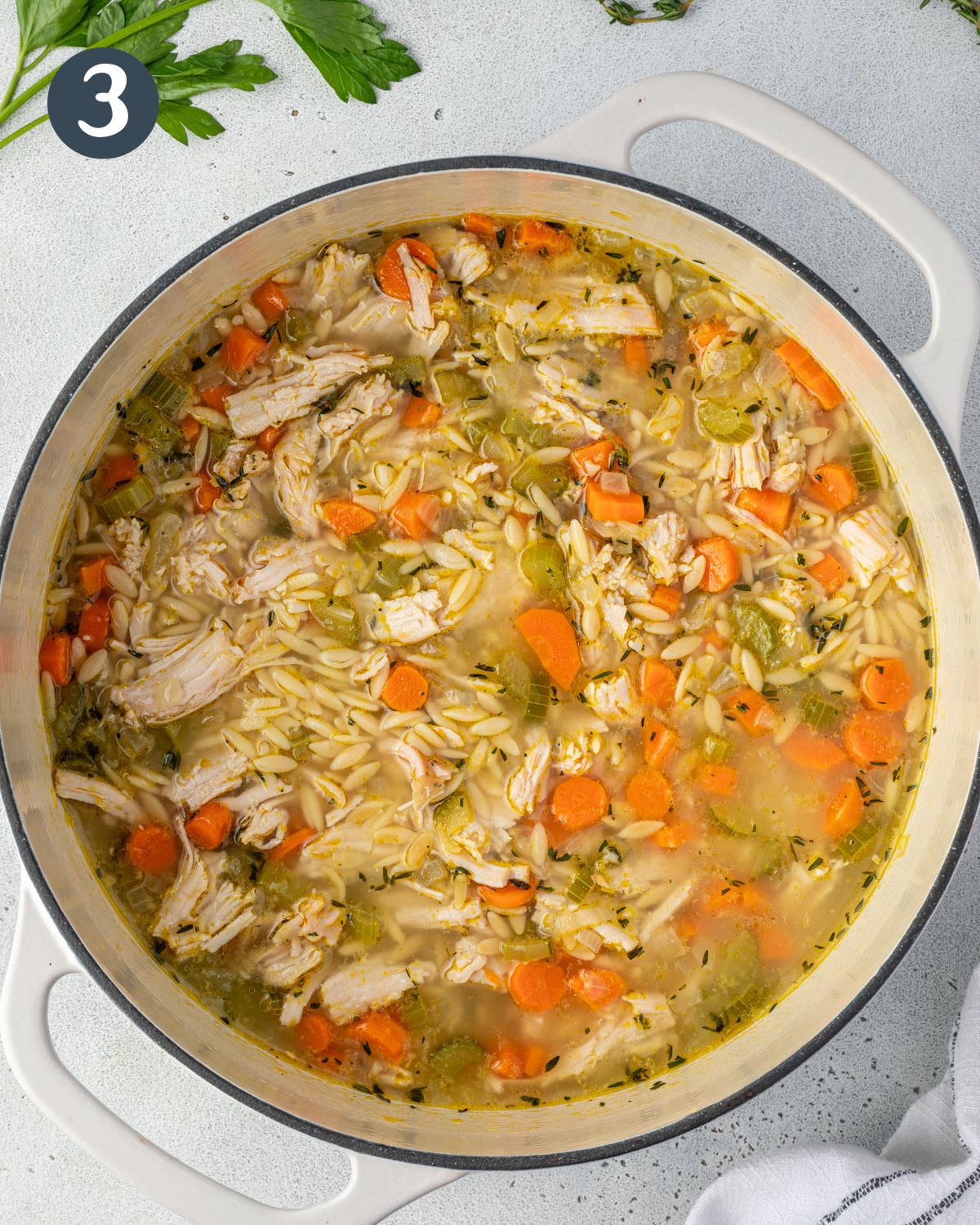A pot of turkey orzo soup just before serving.