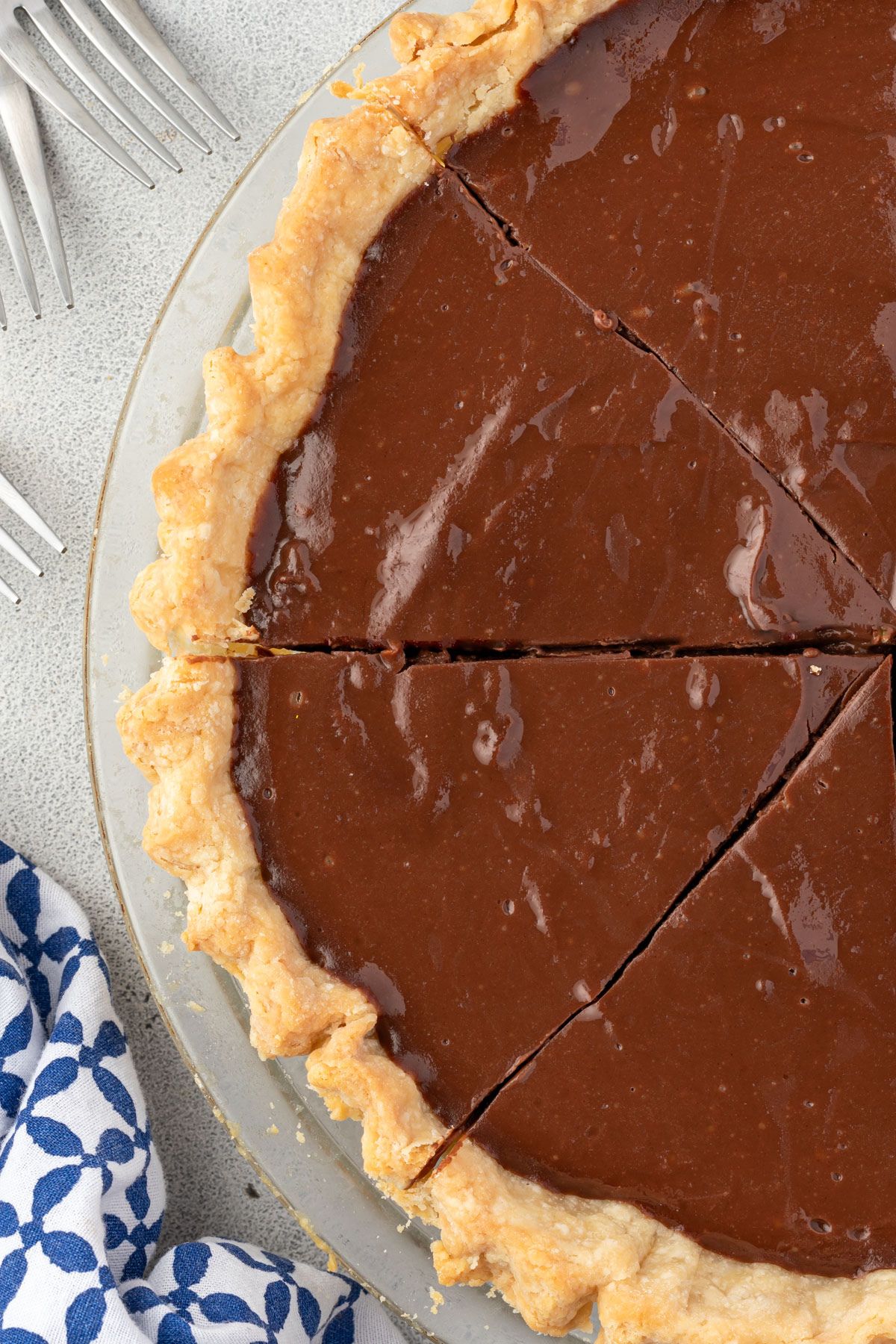 Chocolate pie without topping, cut into slices.