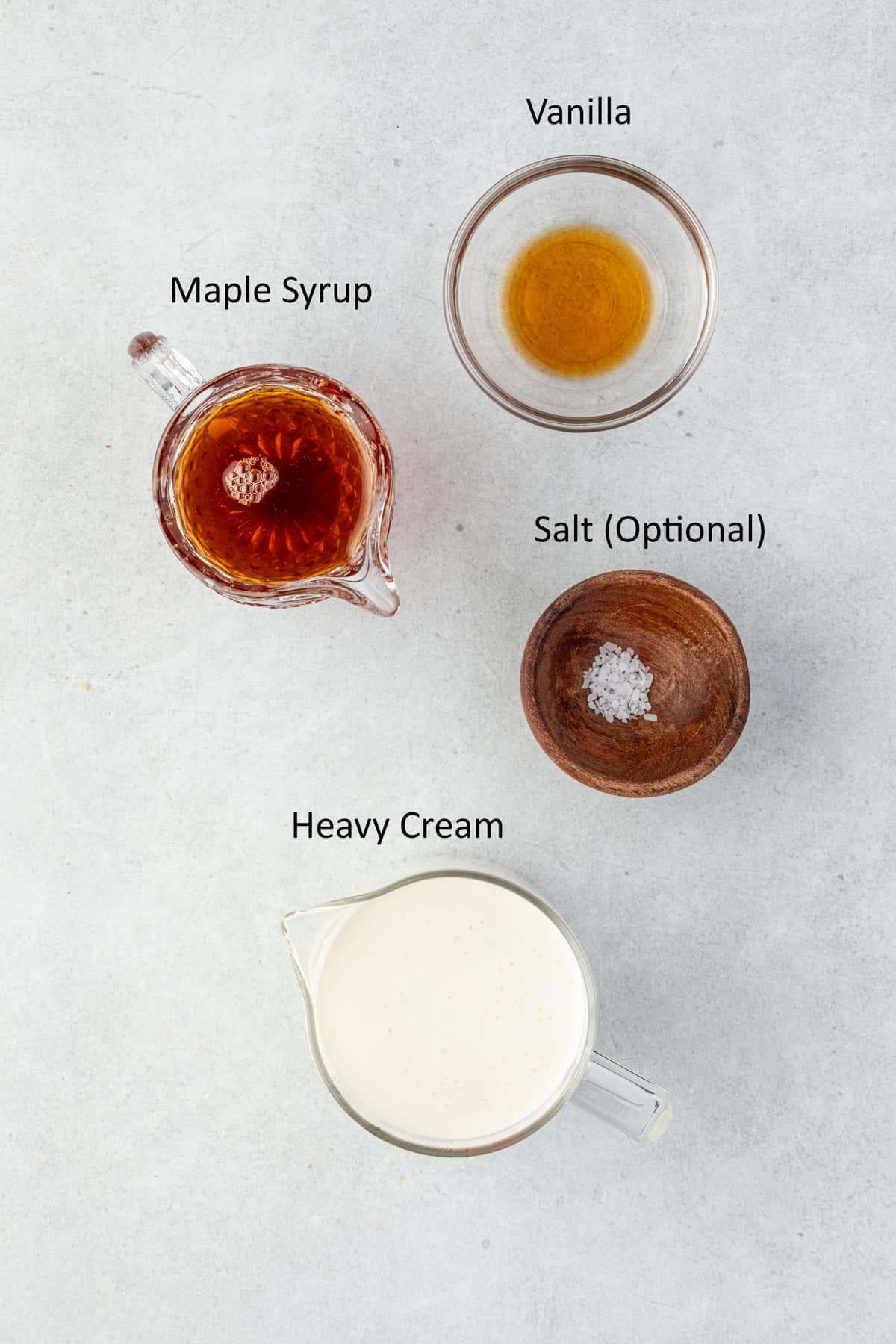Maple syrup, vanilla, salt, and cream in individual containers.