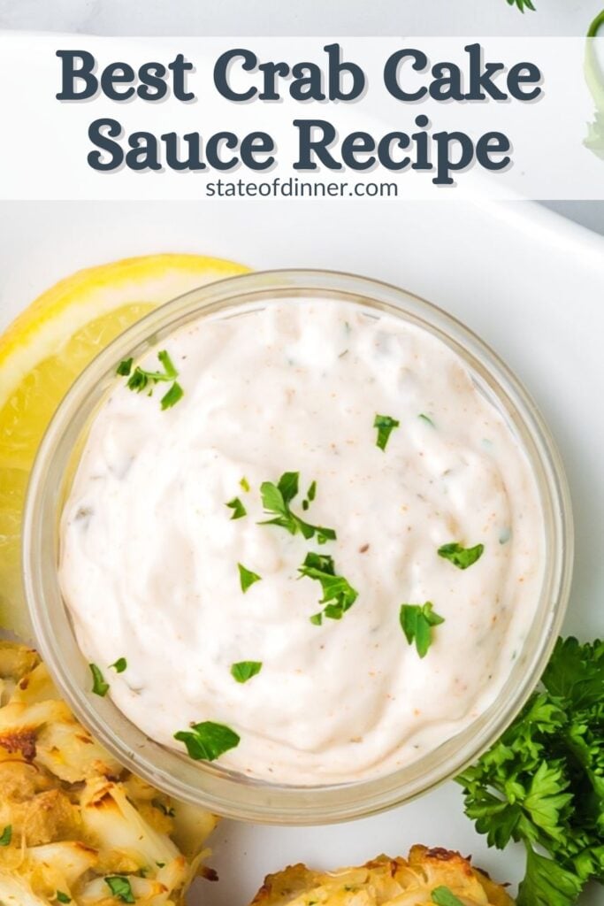 Pinterest pin that says "best crab cake sauce recipe" and has a bowl of sauce garnished with chopped parsley.