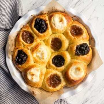Pastries in a round baking dish - each one is filled with a different fruit or cream cheese filling.