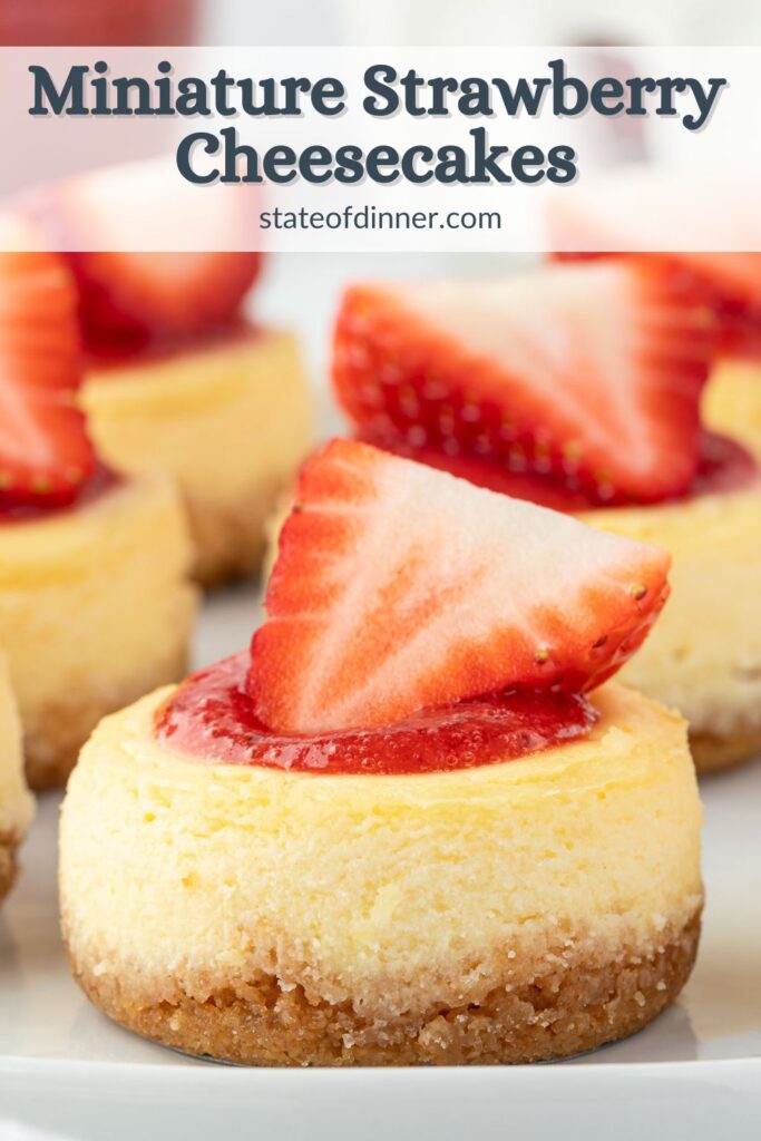Pinterest pin that syas "miniature strawberry cheesecakes" and has several mini cheesecakes topped with sauce and fresh strawberries on a platter.
