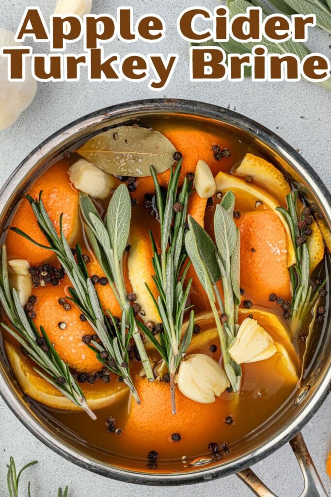 Easy Recipe: A pot of apple cider turkey brine infused with oranges, garlic, bay leaves, rosemary, sage, and peppercorns.