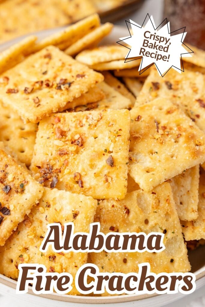 Close-up of crispy, seasoned crackers with text: "Alabama Fire Crackers" and "Crispy Baked Recipe!.
