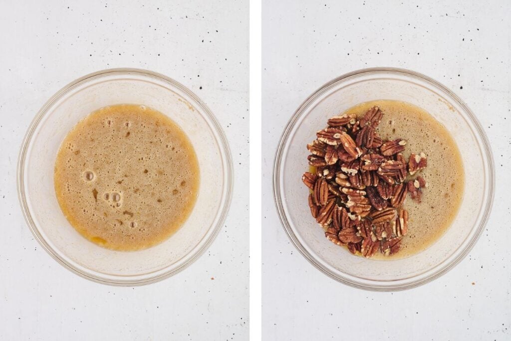 Two glass bowls, one with a foamy liquid, the other with pecans added to the same liquid, on a white surface.