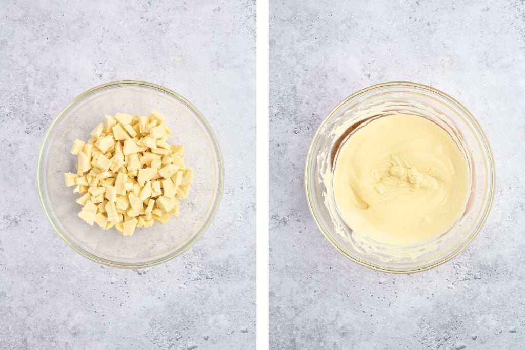 A glass bowl of chopped white chocolate next to a bowl of melted white chocolate on a light gray surface.