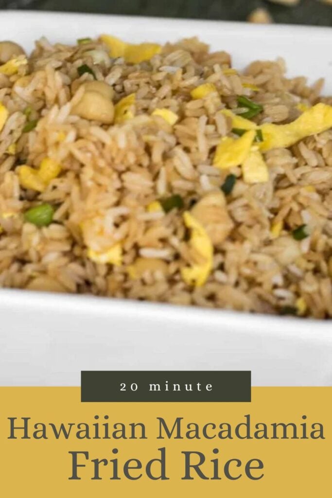A close-up of Hawaiian macadamia fried rice with egg strips, served in a white dish.