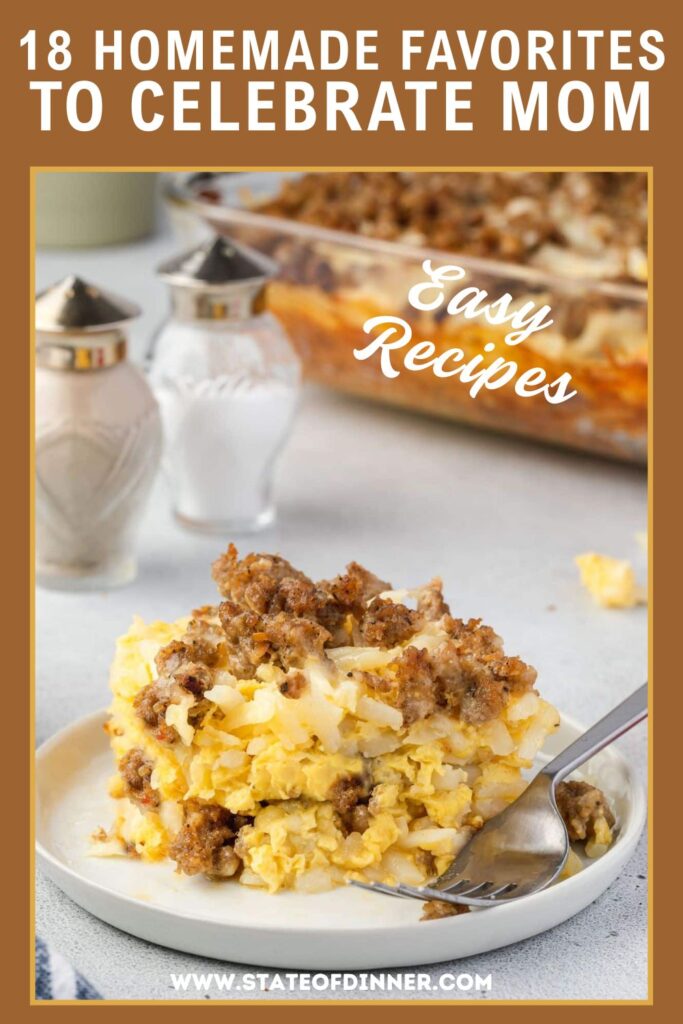 A serving of cheesy hash brown casserole with sausage on a plate, with a baking dish and salt shakers behind it.