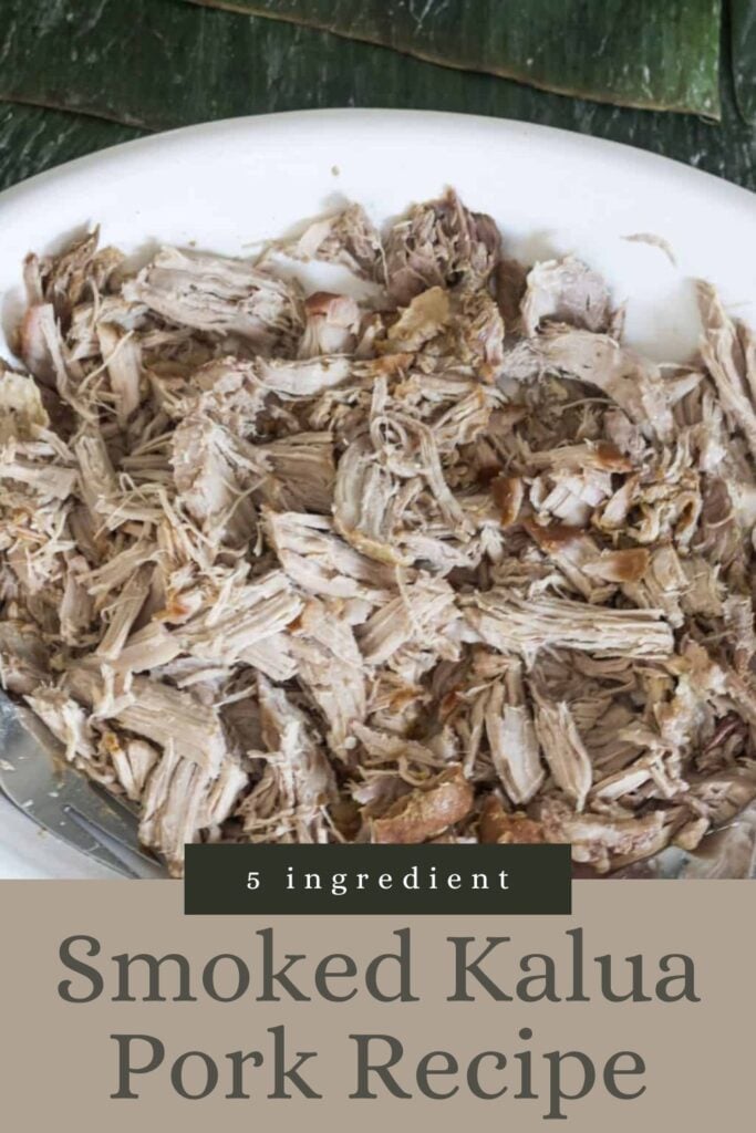 Shredded smoked kalua pork on a plate with text overlay: "5 ingredient Smoked Kalua Pork Recipe.