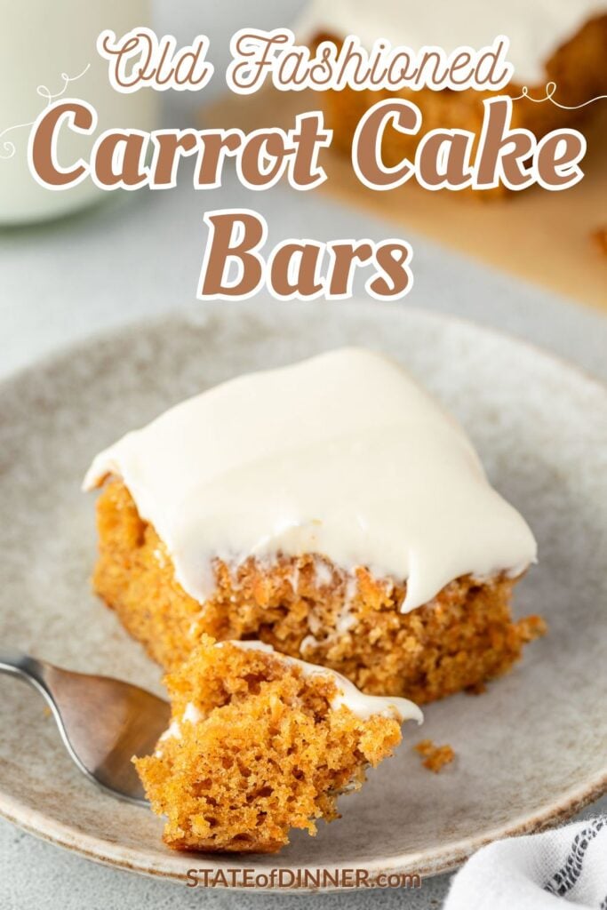A frosted carrot cake bar on a plate with a forkful of cake in front of it.